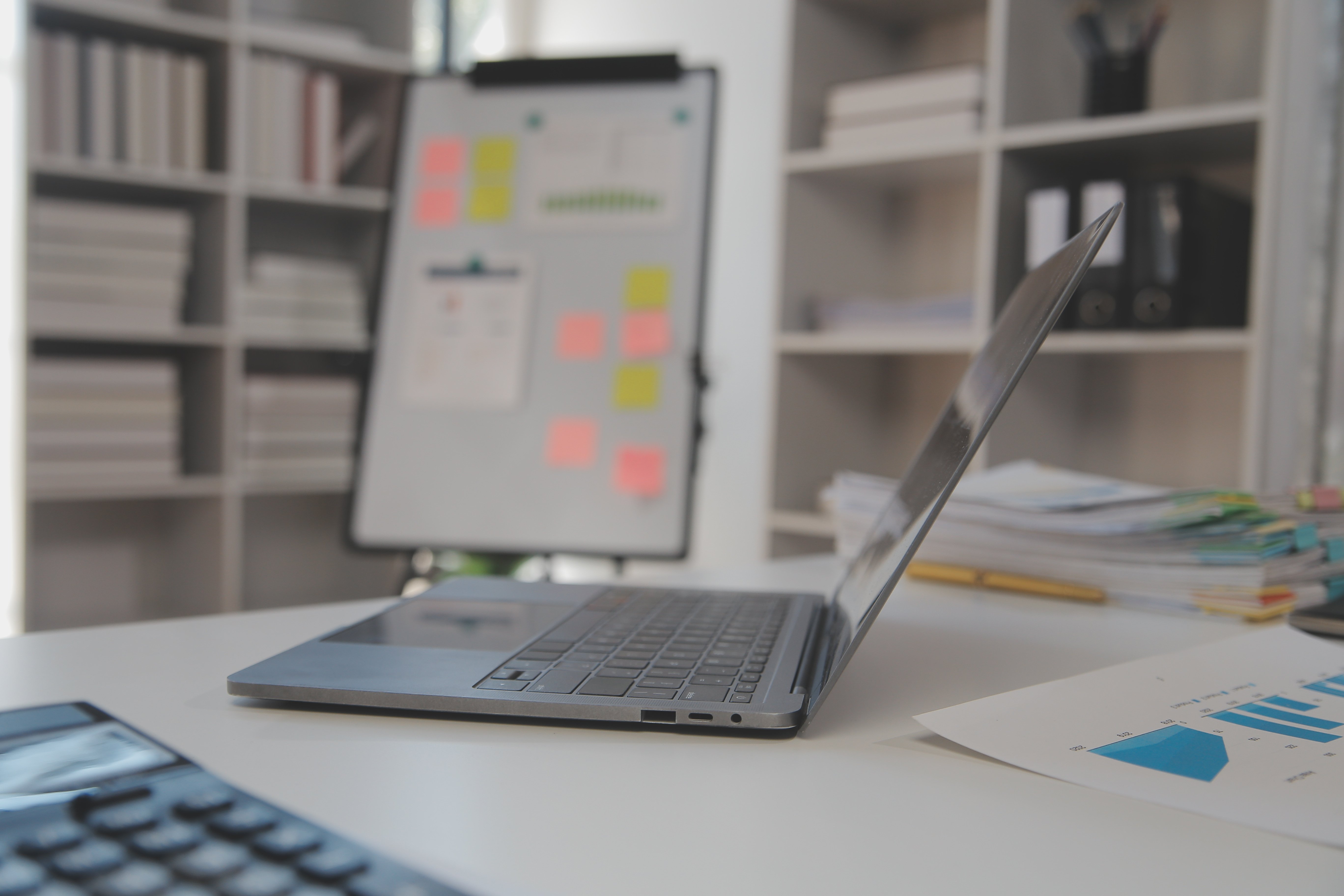 vecteezy_close-up-view-of-simple-workspace-with-laptop-notebooks_44834733